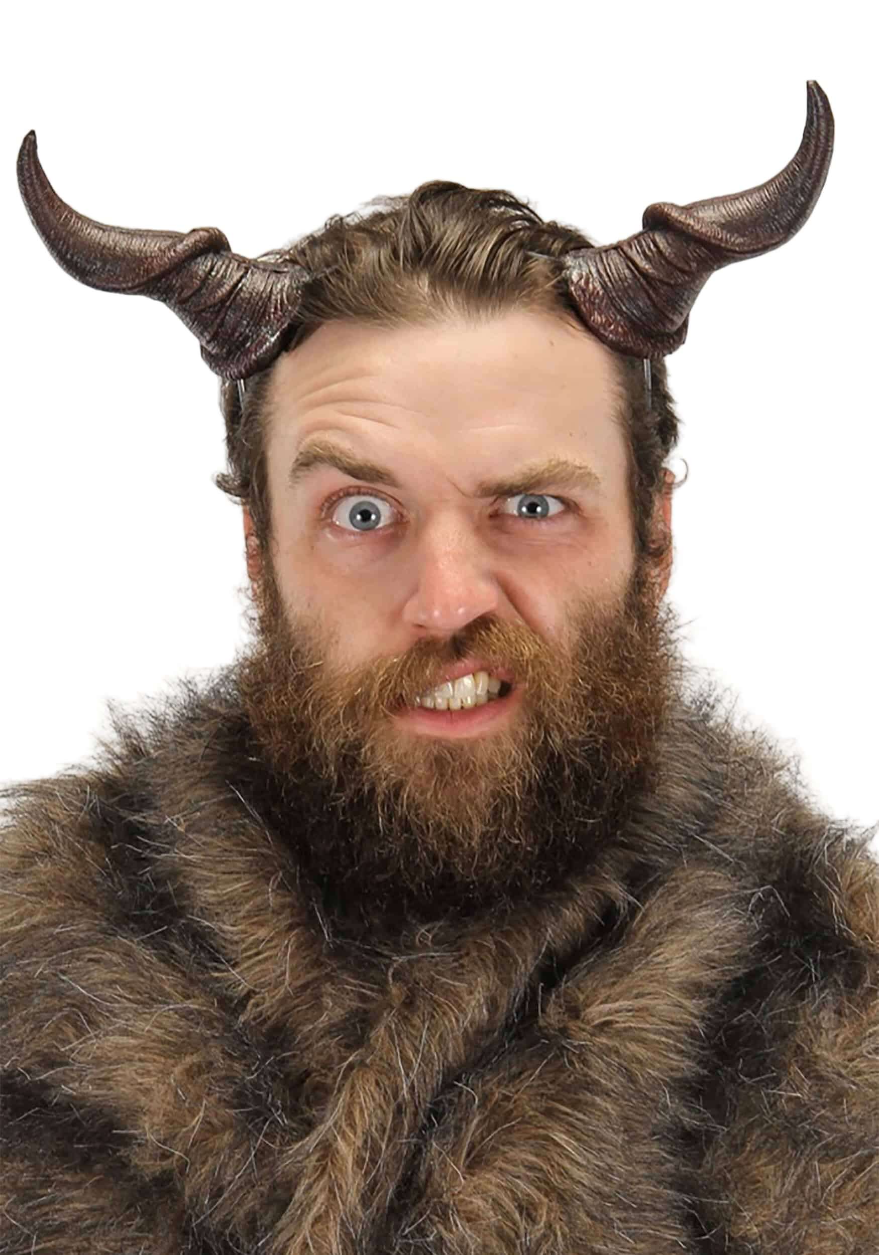 Adult man wearing Beast Horns costume accessory with a wild expression and fur vest.