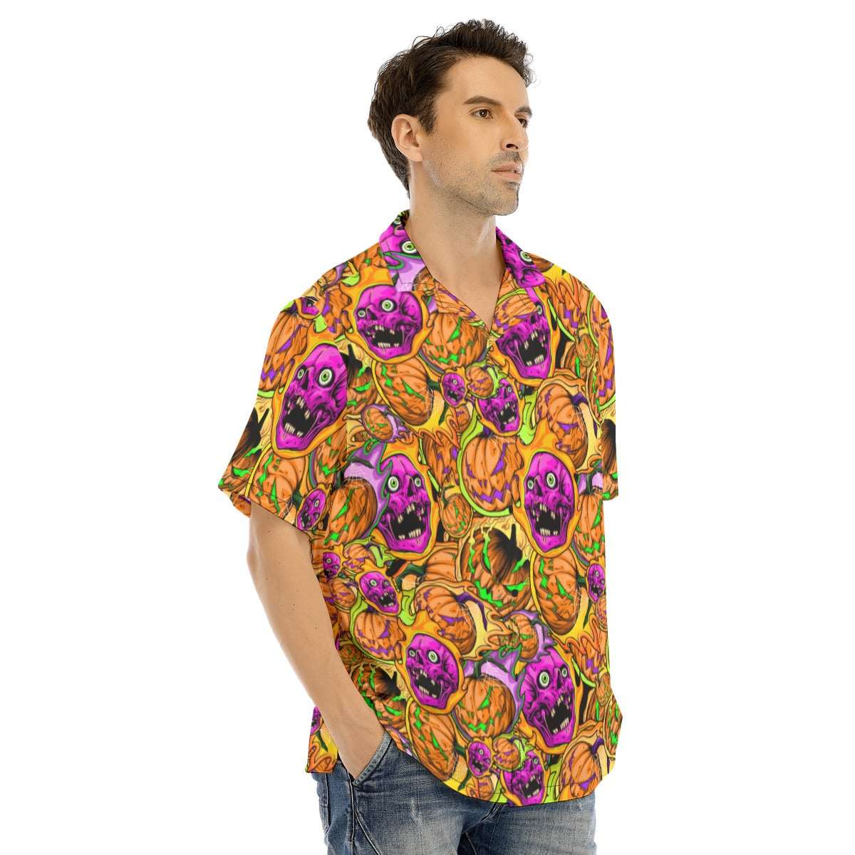 Man wearing a colorful Halloween-themed shirt with pumpkins and ghosts on a white background