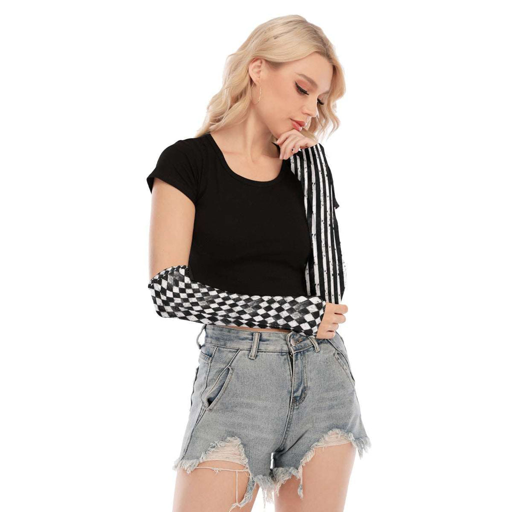 CARNYVL Dirty Diamonds Fingerless Gloves featuring black-and-white striped and diamond prints, perfect for a bold outfit.