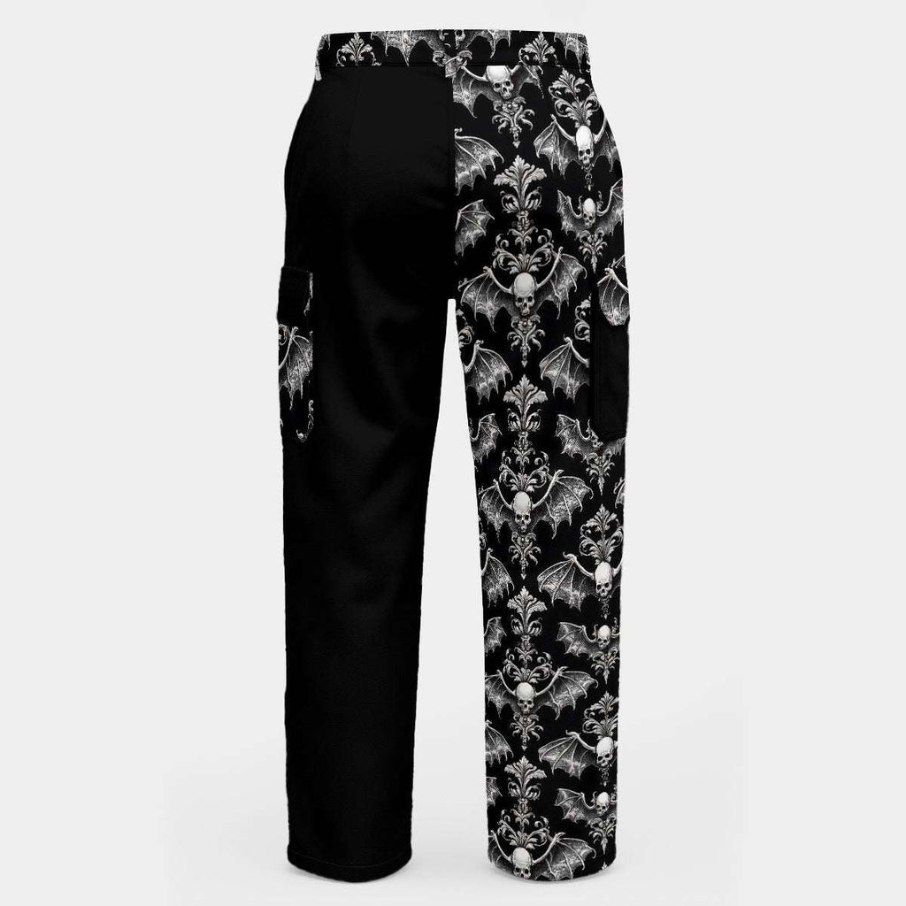 WREKED Winged Skull & Inky Void Printed Cargo Pants showcasing a split design with a bold skull print and black panel.