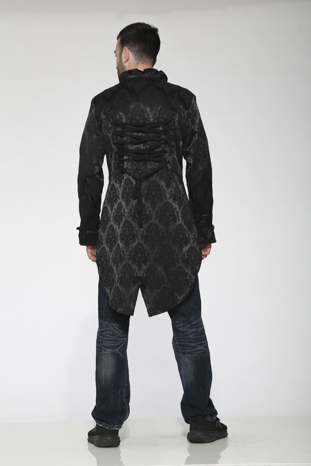 Back view of a model wearing the Black Brocade Tailcoat – Gothic Renaissance Aristocratic Jacket.
