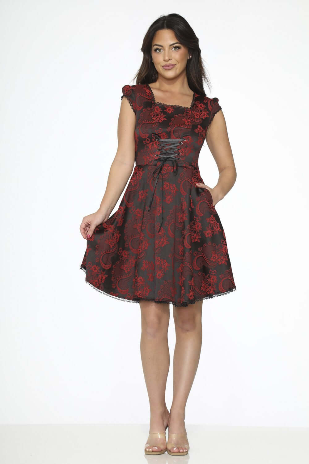 Black red brocade swing dress with pockets showcasing a vintage-inspired design and vibrant red-on-black pattern.