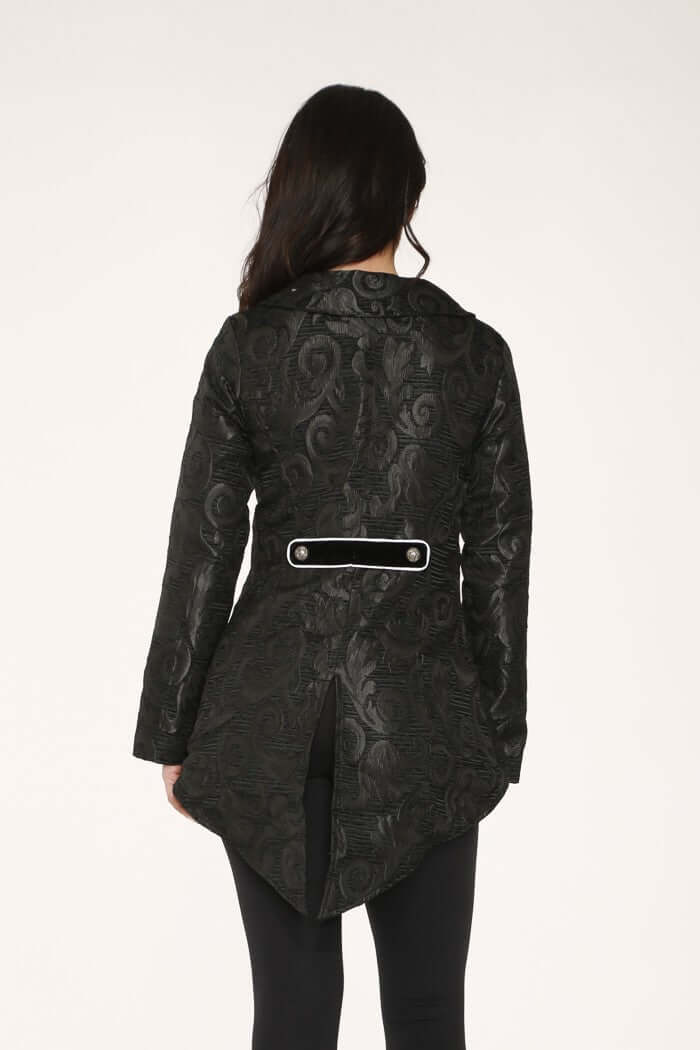 Back view of a Black Brocade Hi-Low Jacket with White Trim showcasing the textured design and pointed hem.