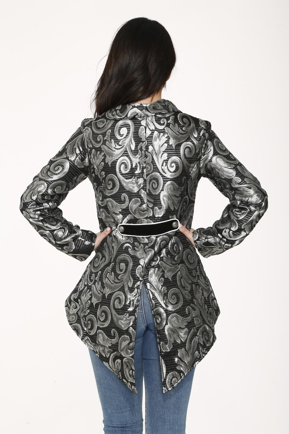 Back view person wearing a black and silver patterned jacket on a white background