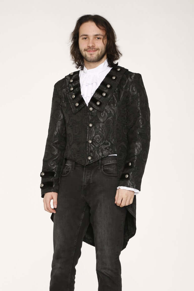 Men's Victorian-inspired black brocade tailcoat worn by a model featuring decorative silver-tone buttons and a gothic style.