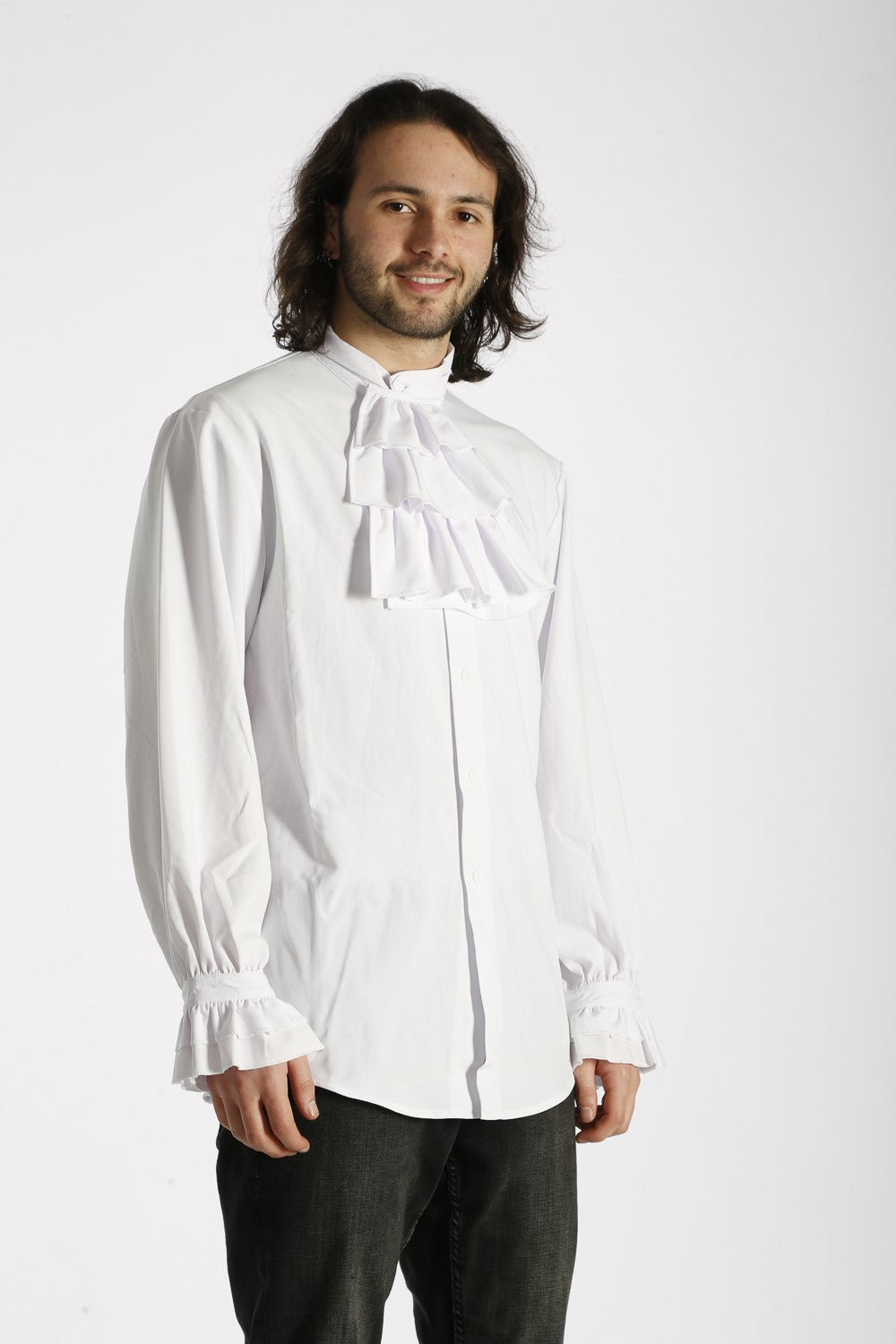 Man wearing a white blouse with a high collar against a white background