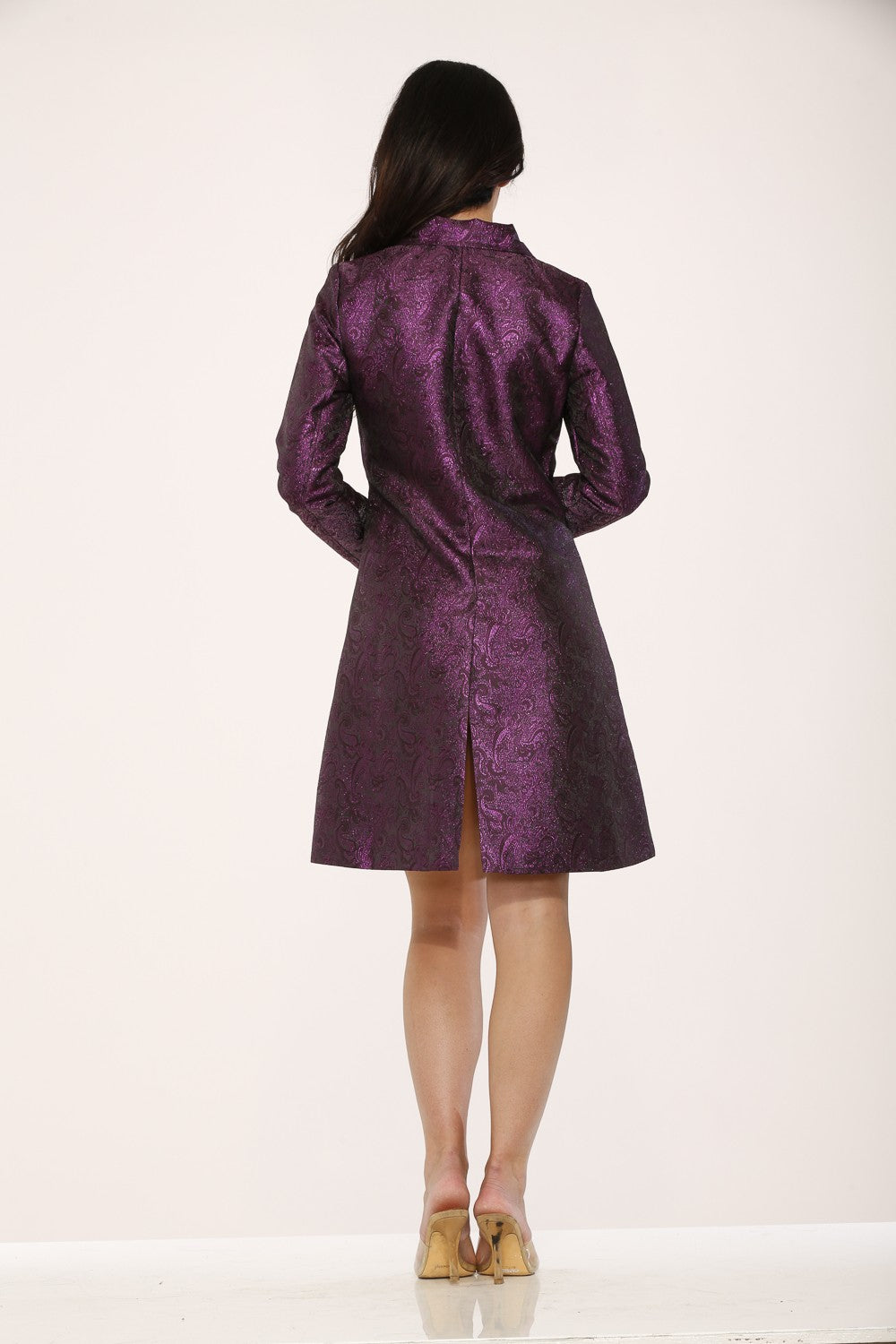 Back view of a stylish purple metallic brocade jacket featuring mock corset lacing and a sleek design.