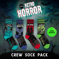 Four-design retro-horror crew sock pack.