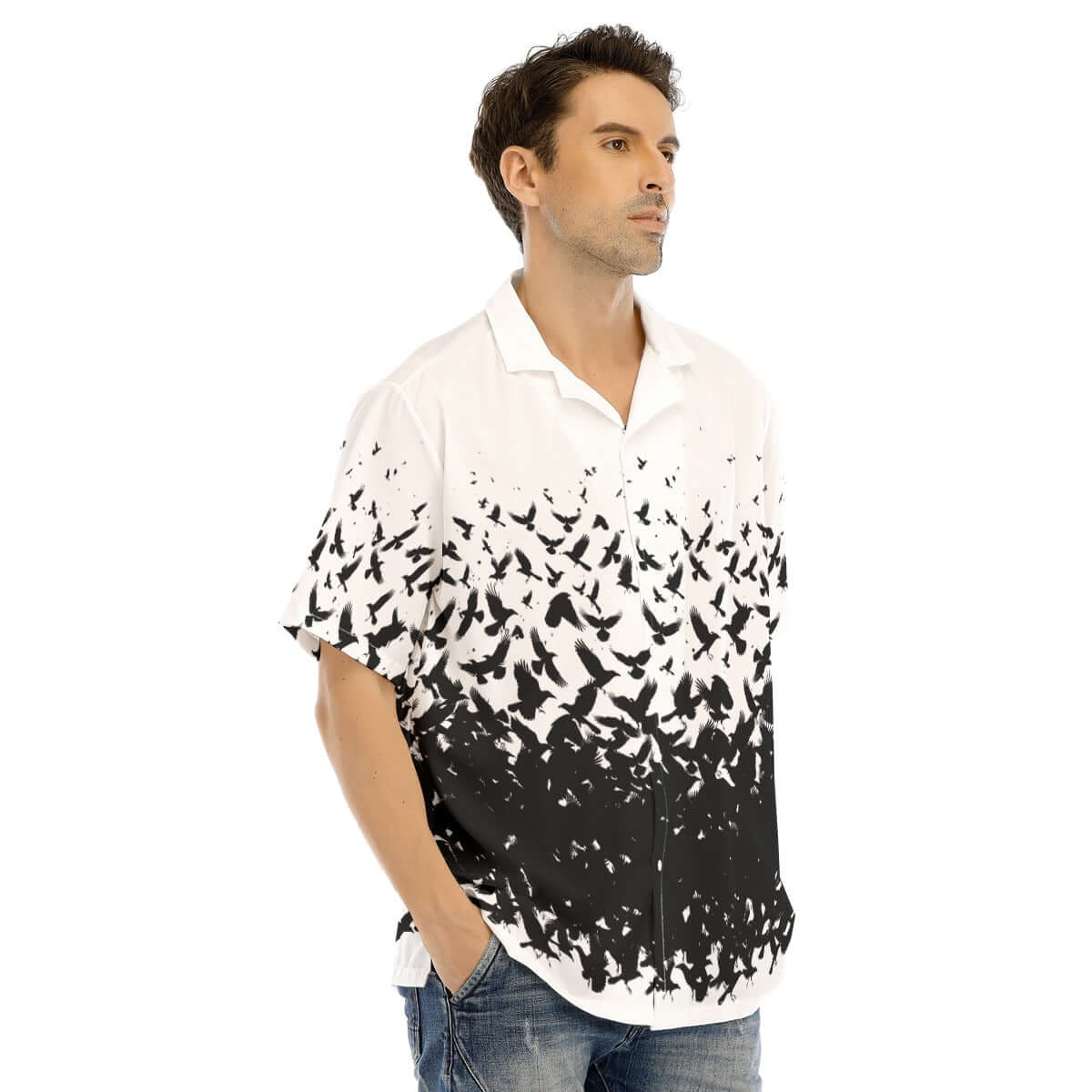 Man wearing a short-sleeve shirt featuring a murder of crows graphic in black and white.