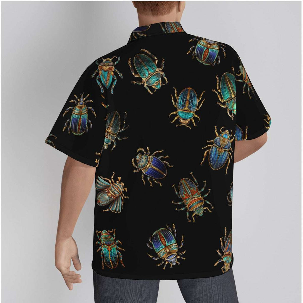 Image of a man wearing the Egyptian Scarabs Gothic Button-Up Shirt with a vibrant scarab beetle print on a black background.