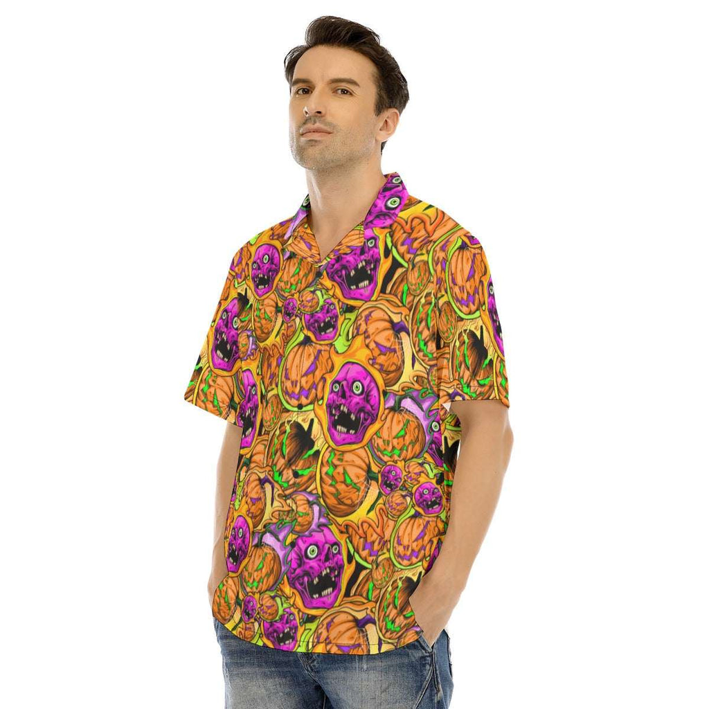 Man wearing a colorful Halloween-themed shirt with pumpkins and ghosts on a white background