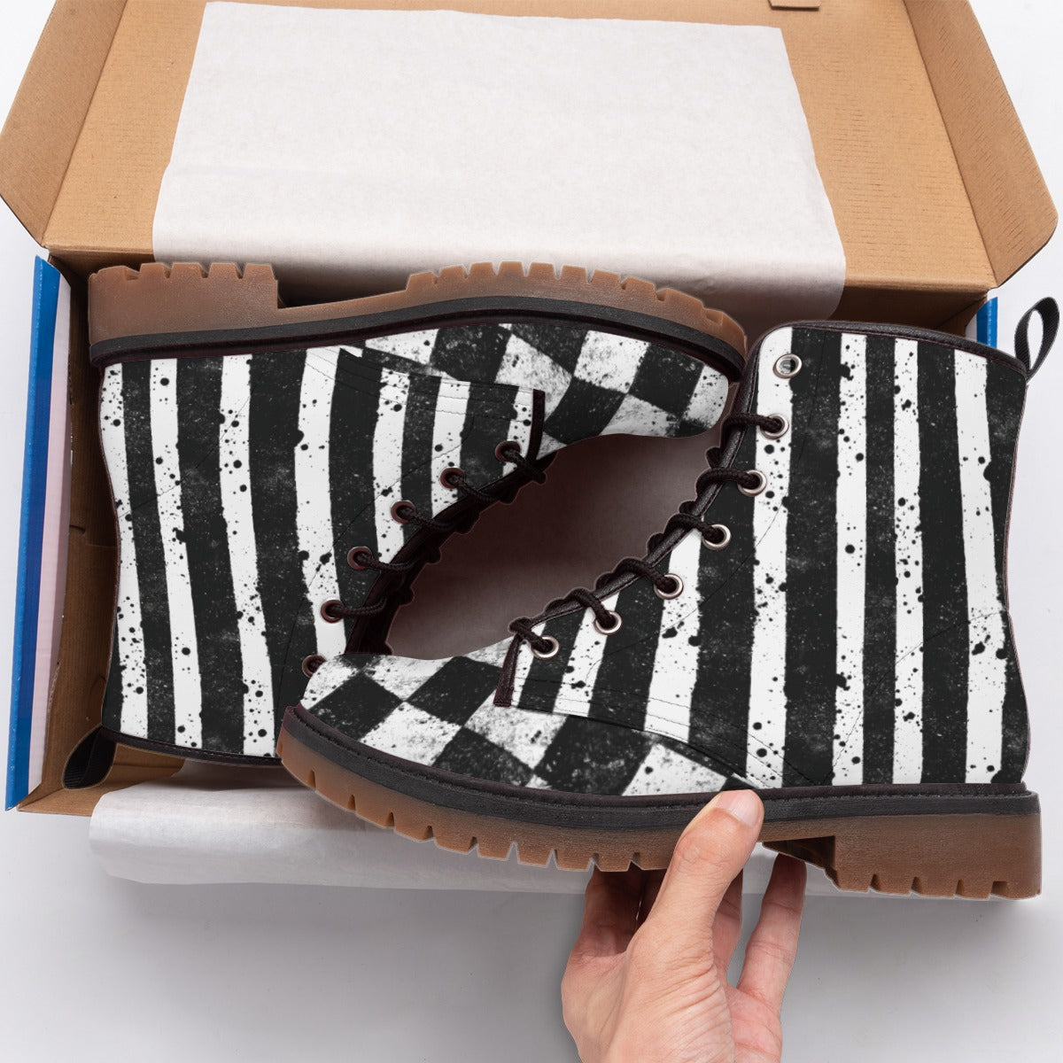 CARNYVL “Dirty Diamonds” Combat Boots with black and white striped design in a shoebox.