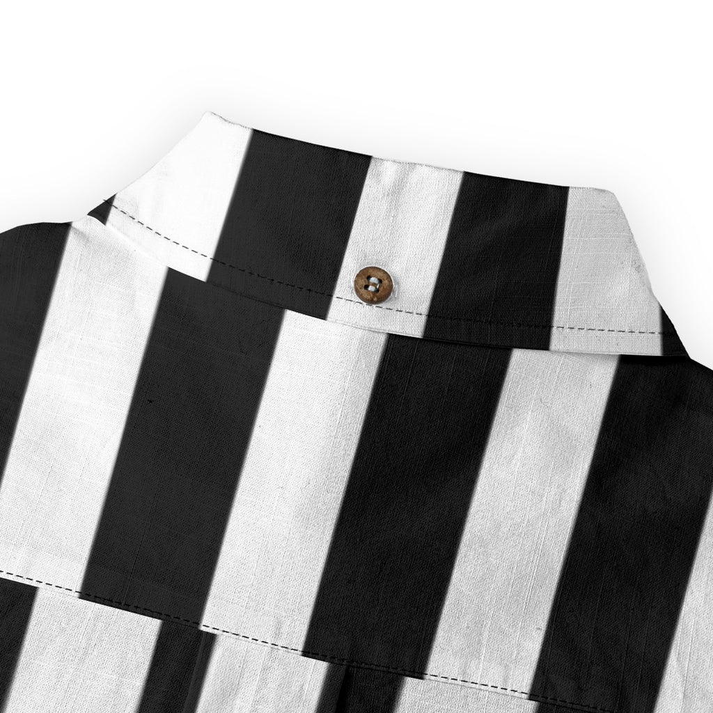 Close-up of the collar of a black and white striped button-up shirt showcasing its slub cotton texture.