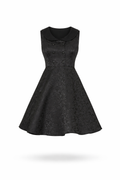 Black brocade swing dress with fold-over collar and flared skirt.