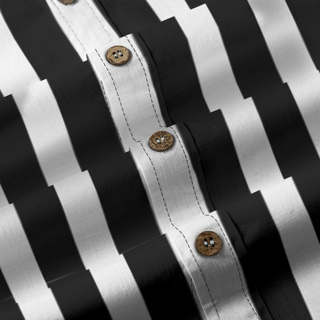 Close-up of Ringmaster's black and white striped button-up shirt showing fabric texture and wooden buttons.