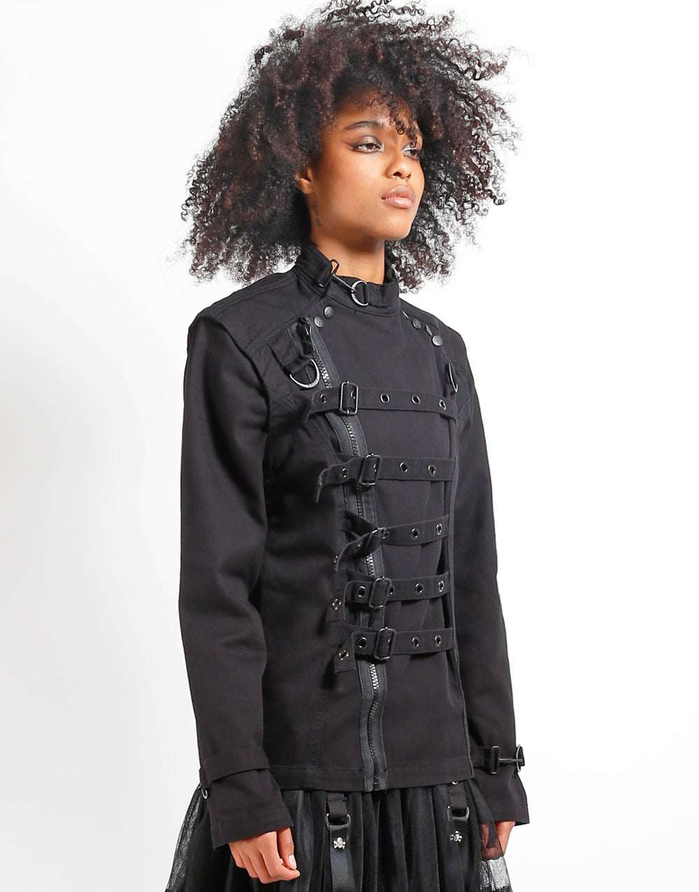 Model showcases the TRIPP zip off buckle jacket with a stylish buckle and zippered design.