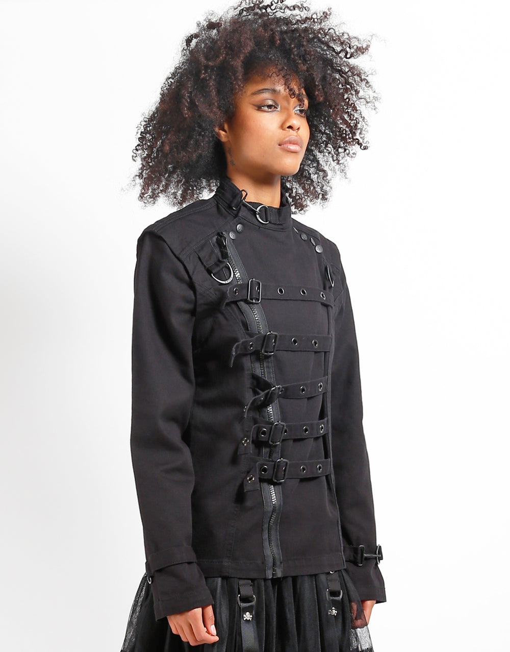 Model showcases the TRIPP zip off buckle jacket with a stylish buckle and zippered design.