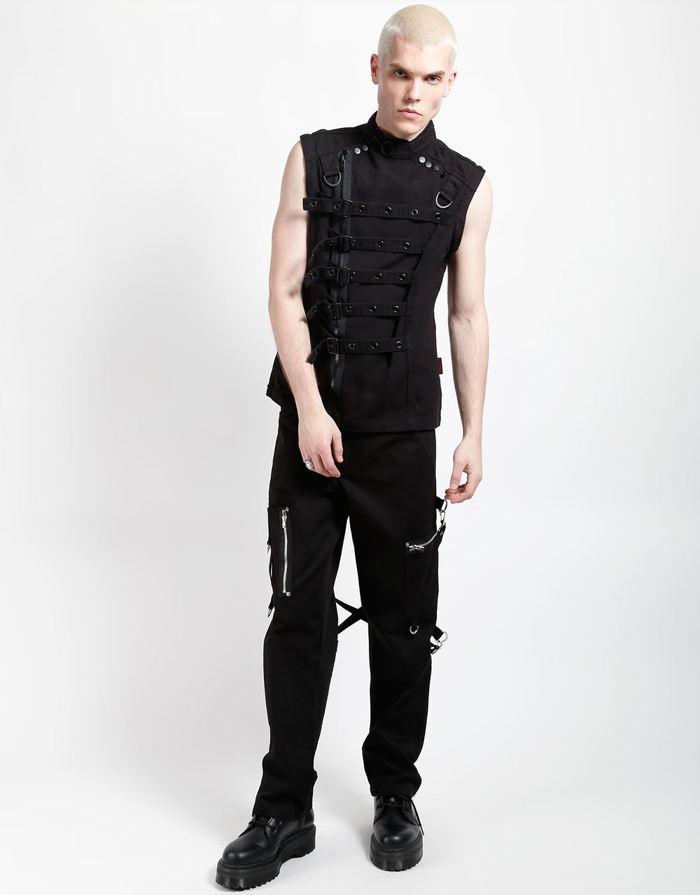 Model wearing a TRIPP Zip Off Buckle Jacket with adjustable buckles and unique styling features.