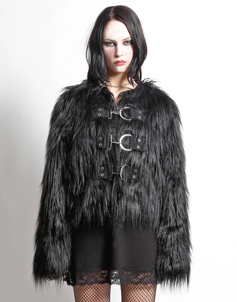 Model wearing TRIPP NYC Furtastic faux fur jacket for stylish outings, featuring industrial clasp closures and a plush texture.