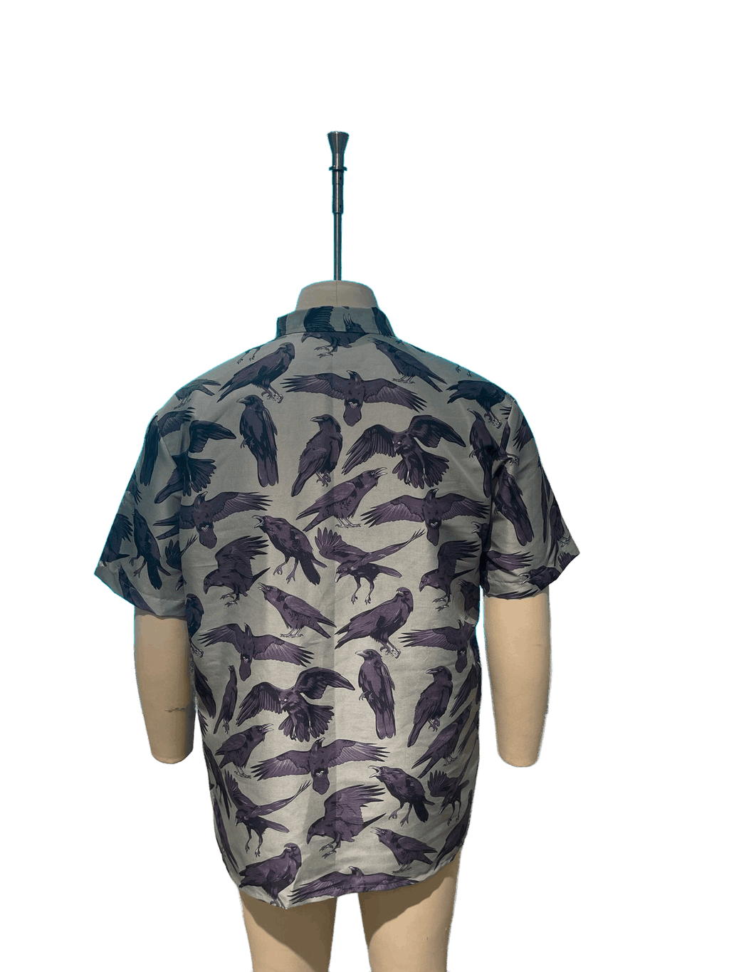 The Flock Gothic Button-Up Shirt showcasing a raven print design from the back on a mannequin.