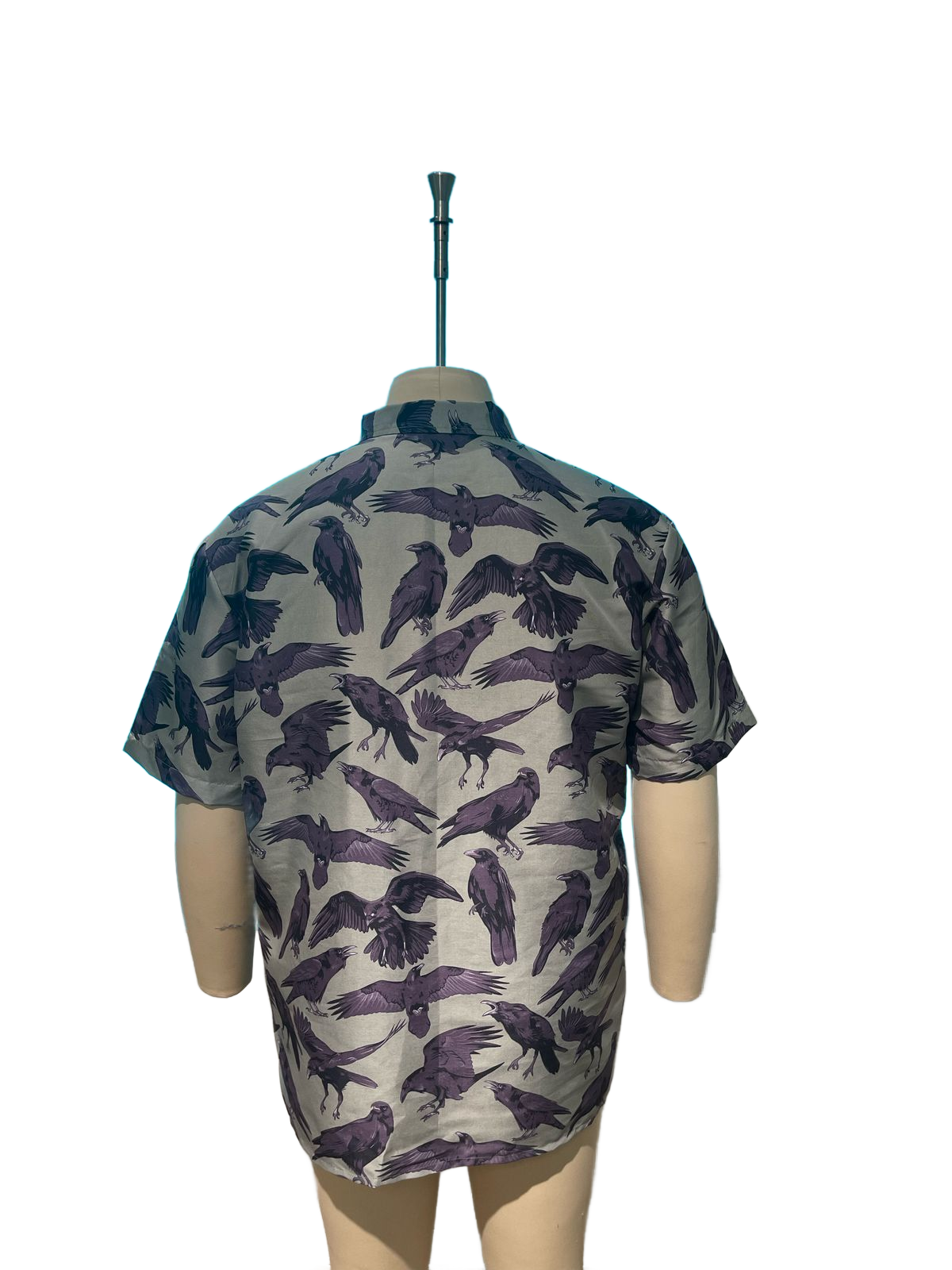 The Flock Gothic Button-Up Shirt showcasing a raven print design from the back on a mannequin.