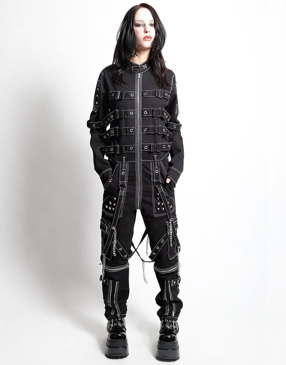 TrippNYC Control Jumpsuit – Unisex Gothic Punk Streetwear on model in stylish black outfit with unique straps.