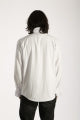 White blouse worn by a person on a plain background